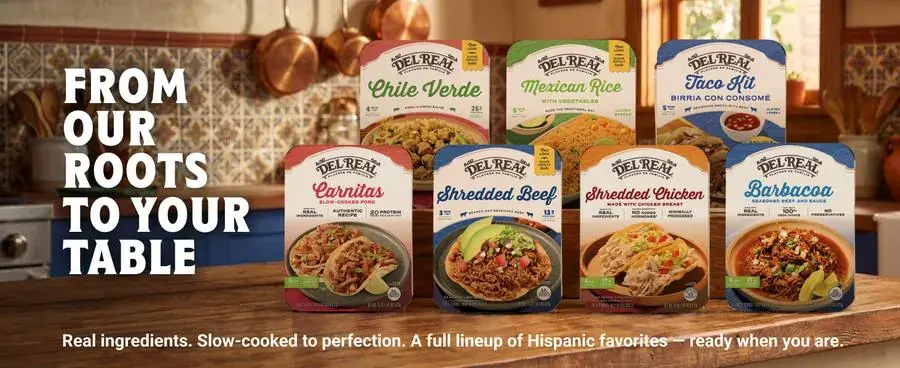 Del Real Foods full product lineup: From Our Roots to Your Table, 8 products displayed in a warm kitchen setting